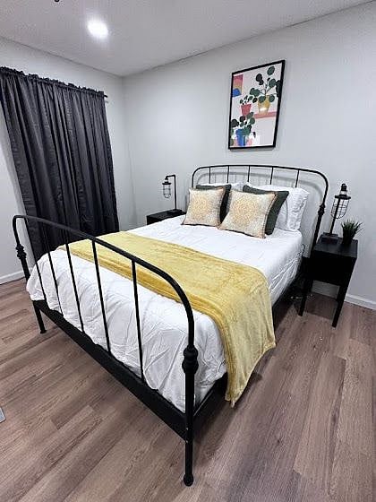 Private bedroom w/ Queen sized bed, blackout  curtains, cooling-comfort mattress, and dual nightstands