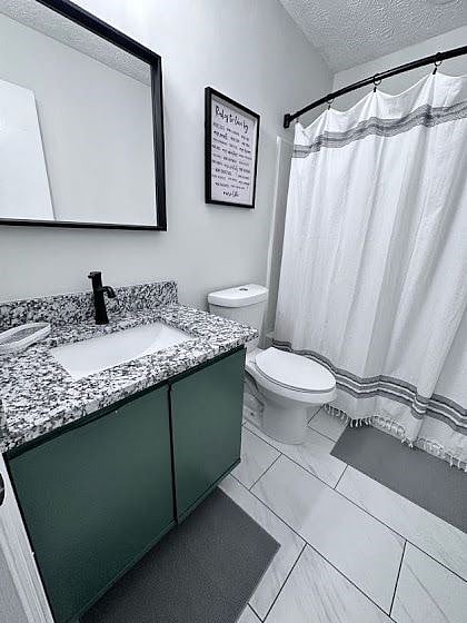 Newly renovated full-sized bathroom with granite countertops