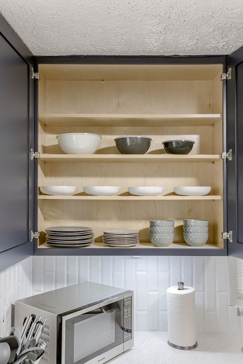 A complete set of dish ware, glassware, flatware and cooking utensils are provided.