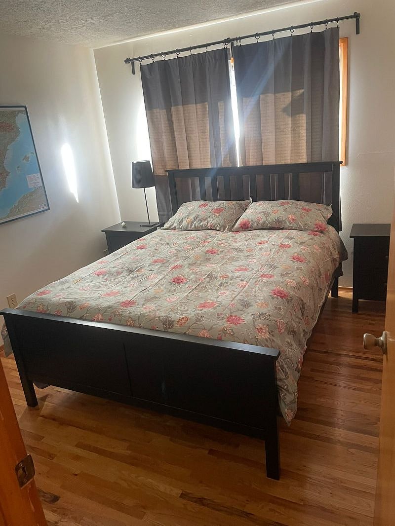 Queen Bed with Blackout curtains.