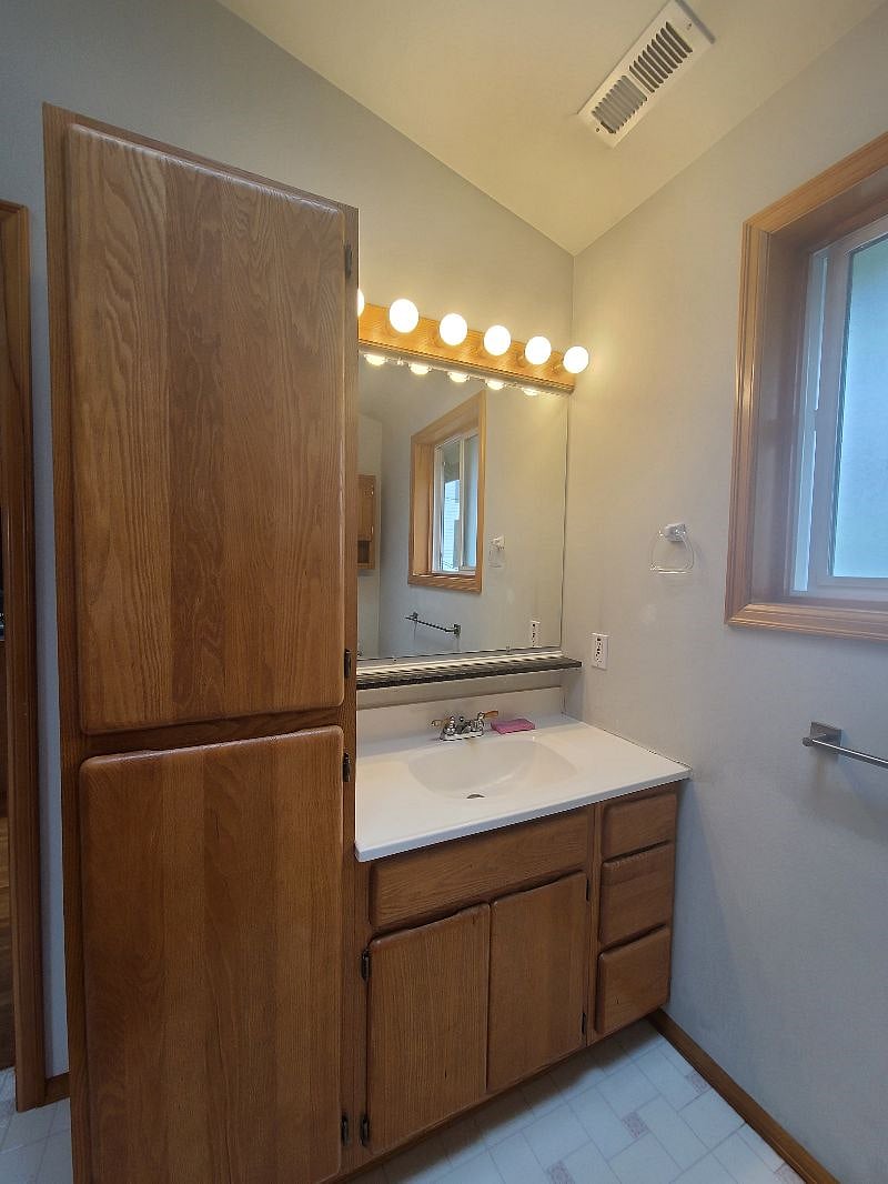 Full Bathroom with Vanity and storage