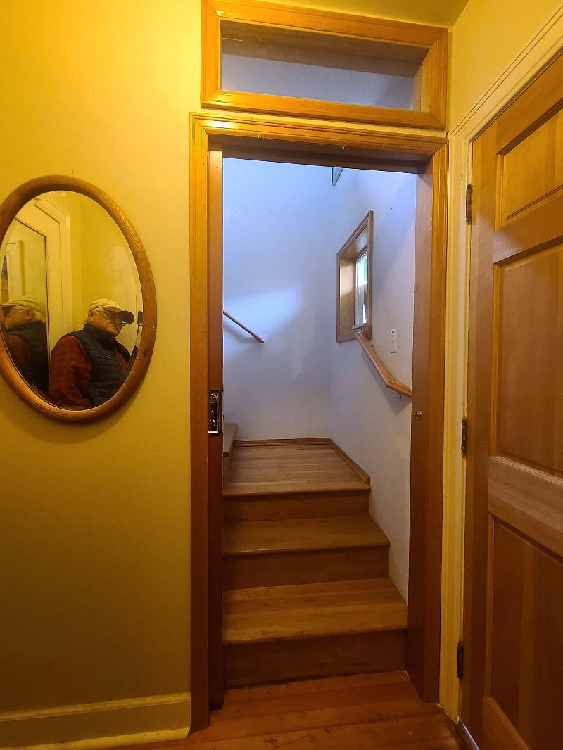 Door opened, showing stairs to unit