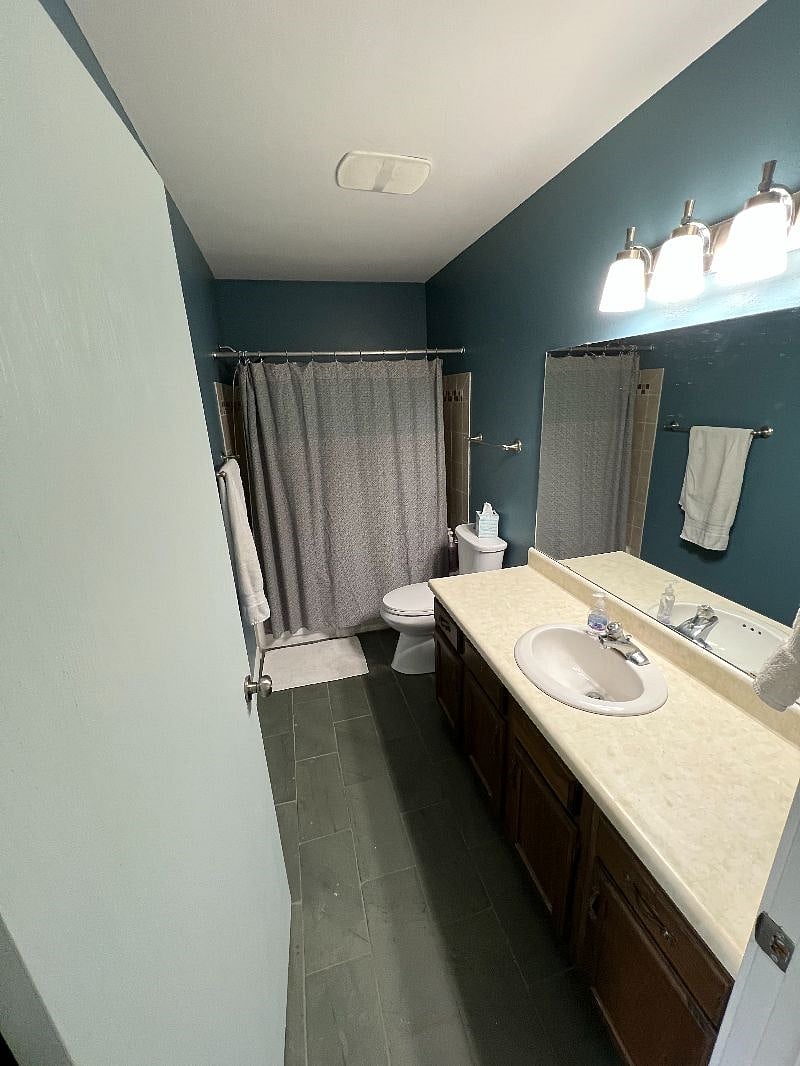 Shared full bathroom. Plenty of storage space and linen closet right outside the door.