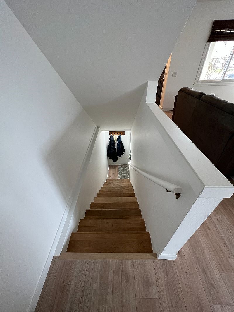 Stairs down to garage and laundry area.