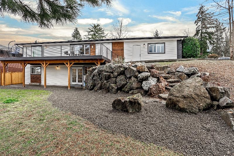 Back of house showing large yard and the separate entrance for the Lower Unit