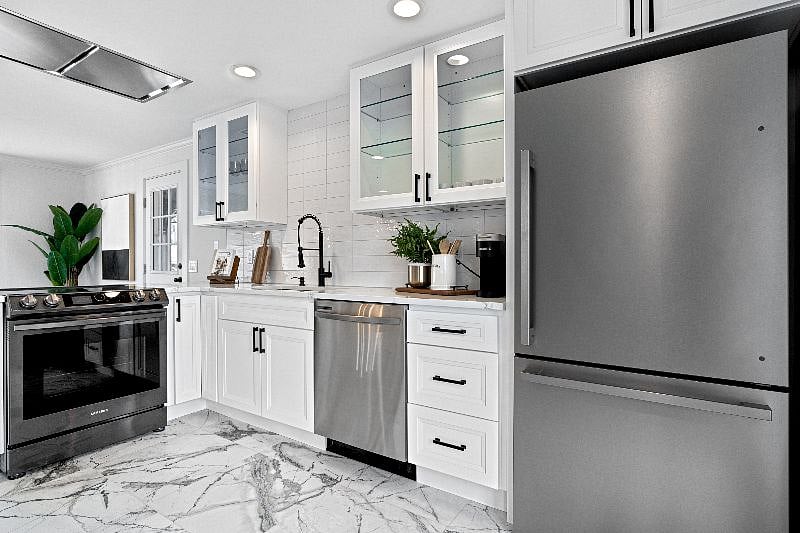 Upper Unit 2BD / 2BA:
Kitchen with quartz countertops and SS appliances