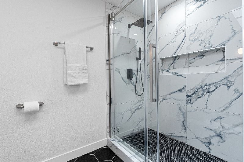 Upper Unit 2BD / 2BA:
Primary ensuite bathroom shower