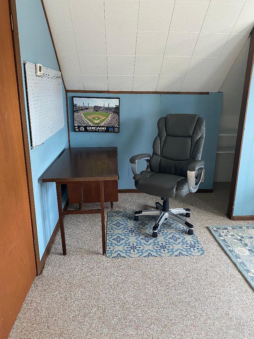 Bedroom #2 has desk with office chair to study or stay organized within the room 