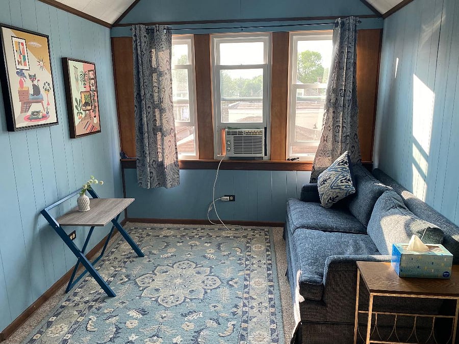 Bedroom #2 has lounge area with loveseat and space to relax, read or do whatever makes you happy. 