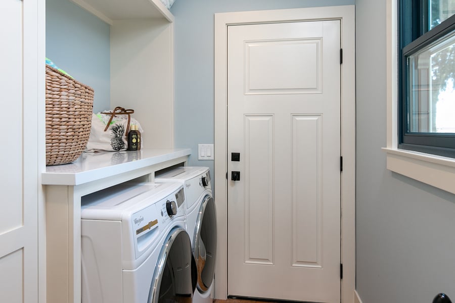 Laundry room with washer dryer and pantry.D