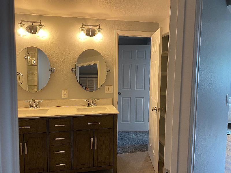 Double sink and large vanity with lots of storage.