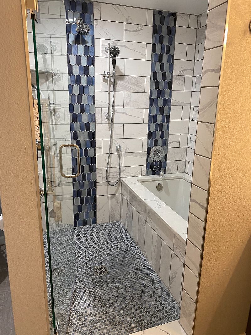 Large shower with large soaking tub.