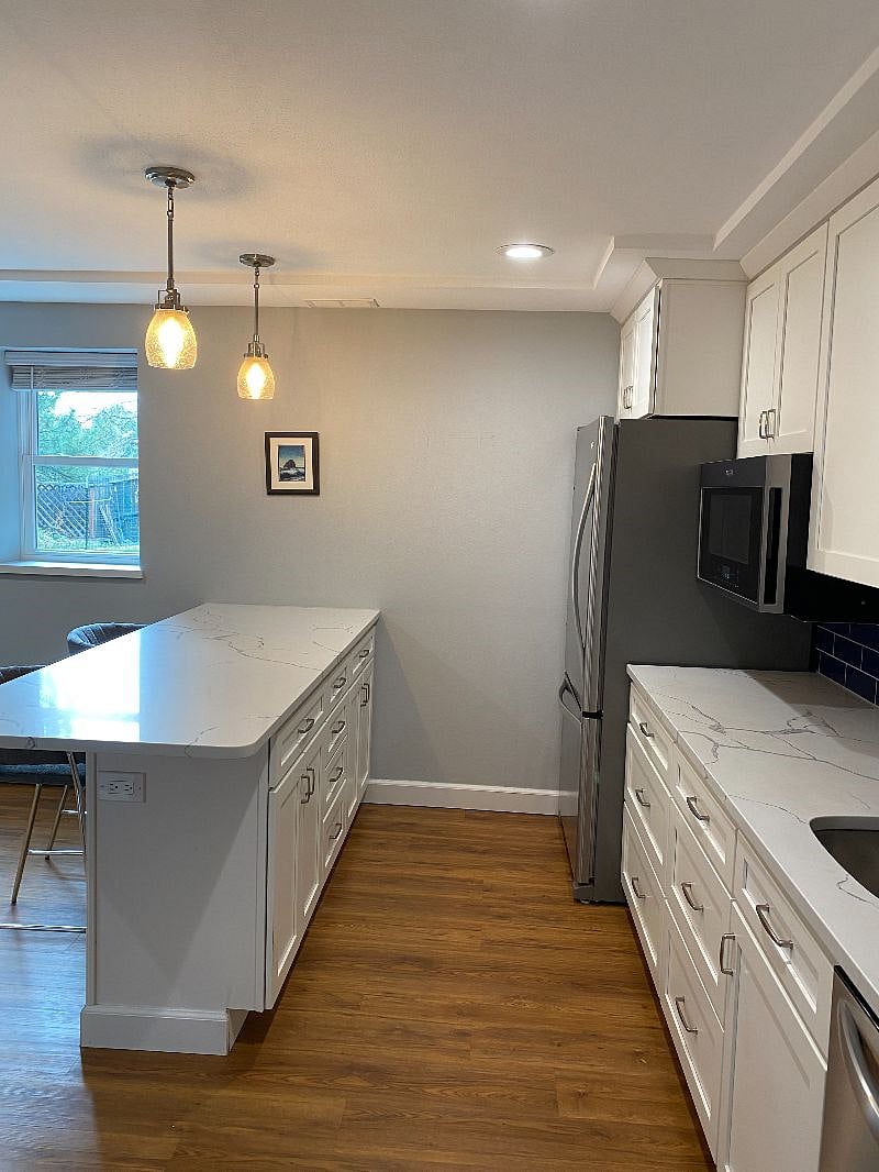 Kitchen with quartz countertops.