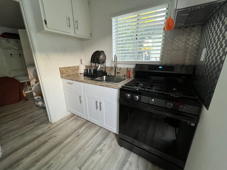 Another view of full stocked kitchen.
-dishwater
-cooking utensils
-dinnerware
-glasses
Too many things to list