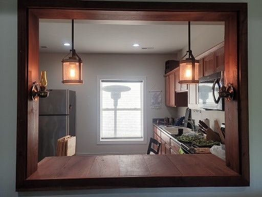 Looking into kitchen from living room passthrough