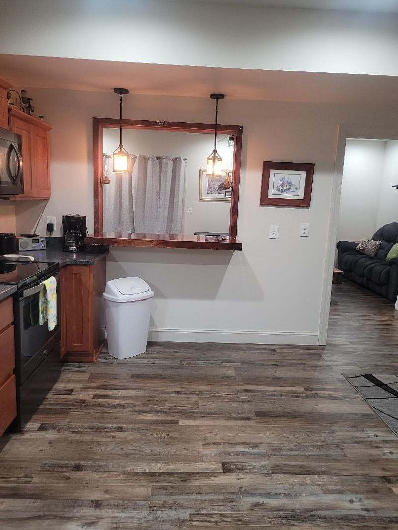 Kitchen sink and countertop looking into the living room