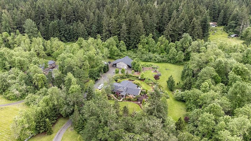 The home is on the far left of the aerial photo.