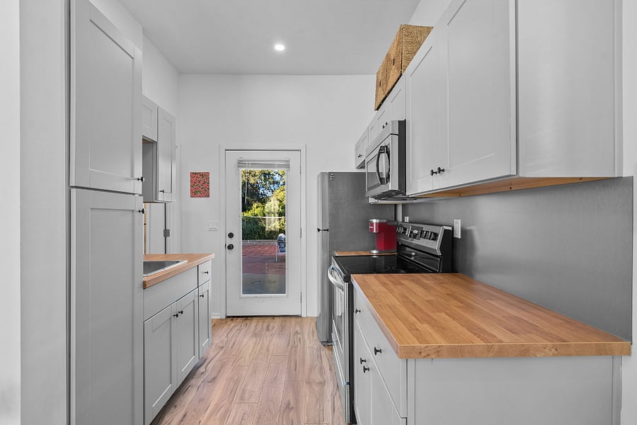 Kitchen: Sink, Strove, Oven, microwave, refrigerator w/ ice maker, Keurig coffee maker.