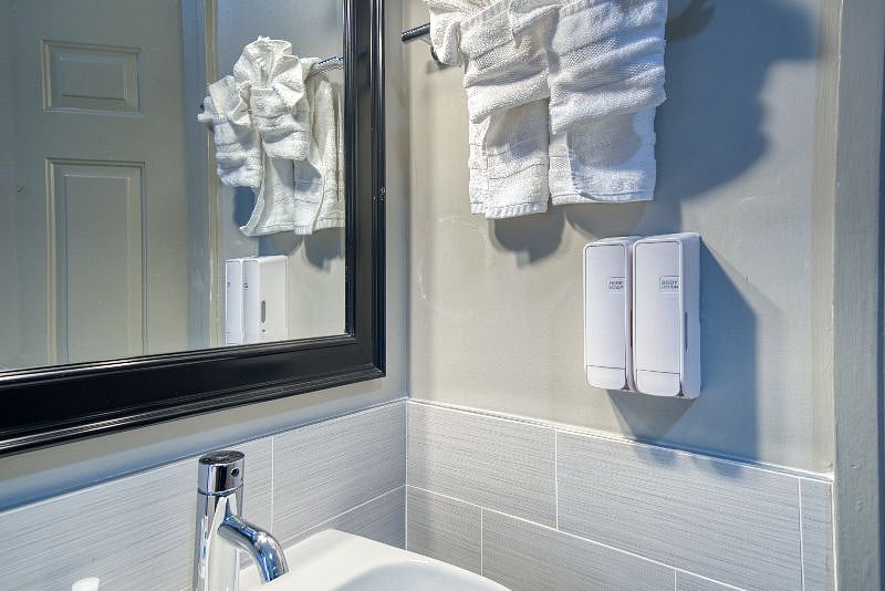 In Room sink, soap, mirror, and towels
