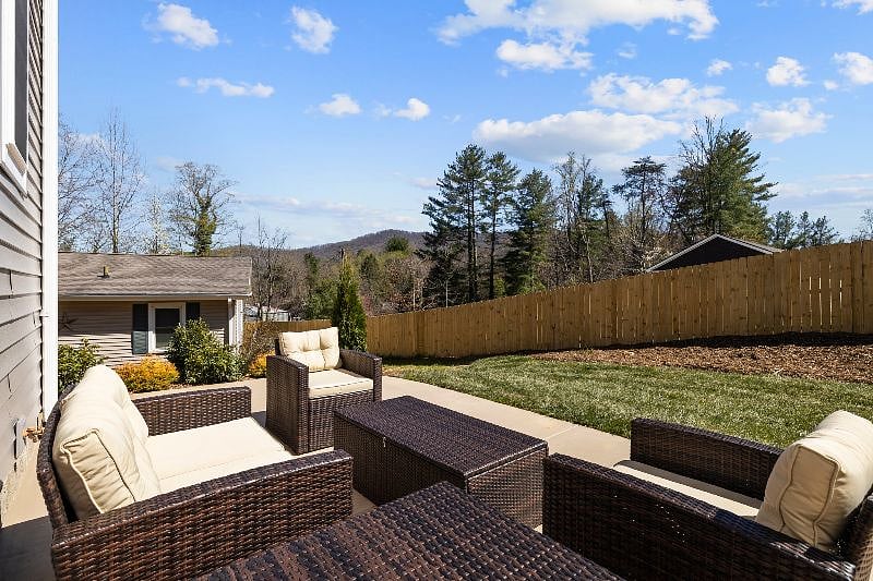 The backyard has a lovely little mountain view.