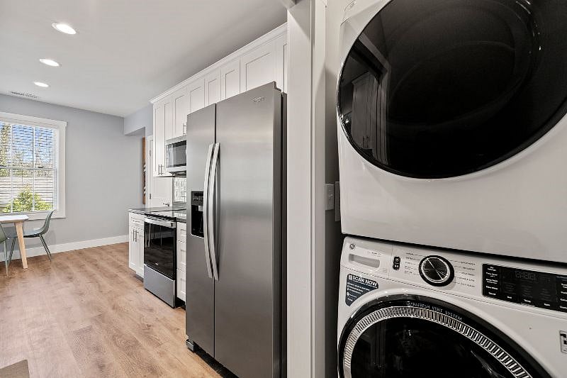 Alternate view of kitchen, with pocket door that opens to a brand new washer and dryer.