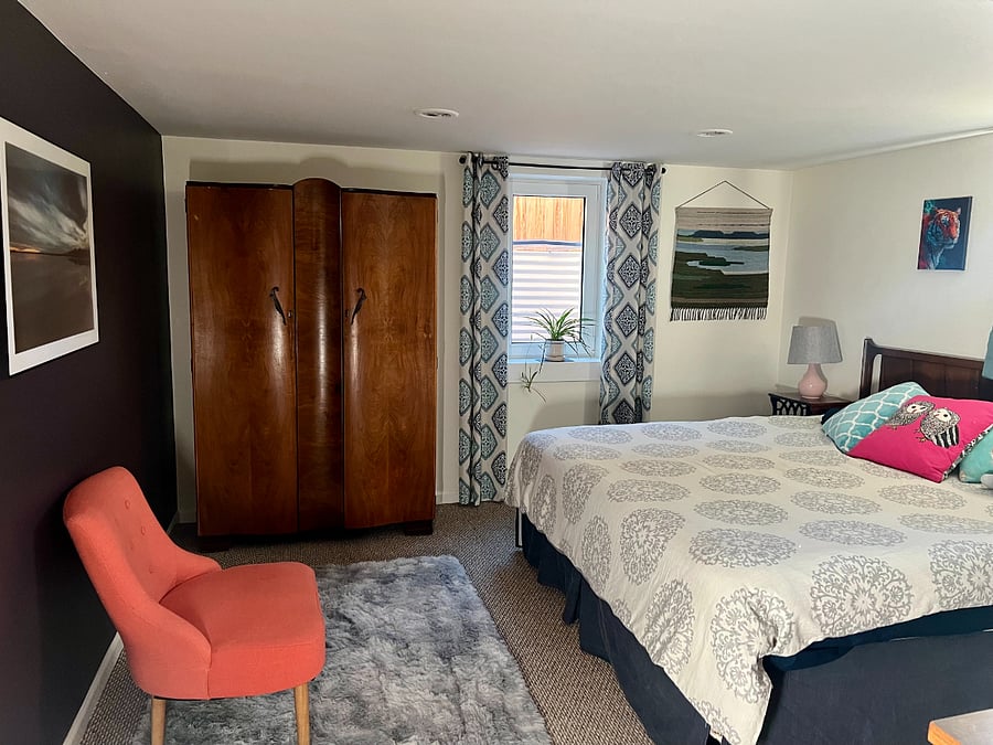 Downstairs bedroom with King Bed.  South-facing egress window. 