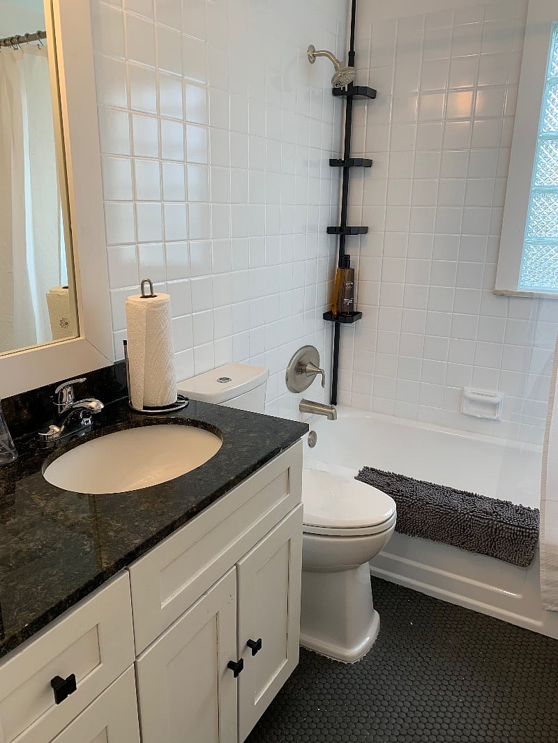 Full bath with granite counters and touchless toilet