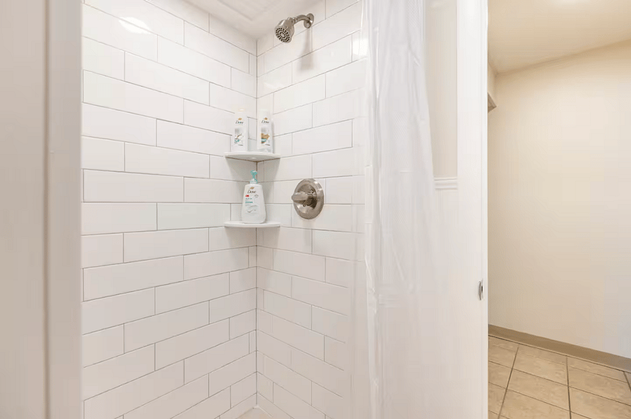 Custom tiled shower with starter shower essentials.