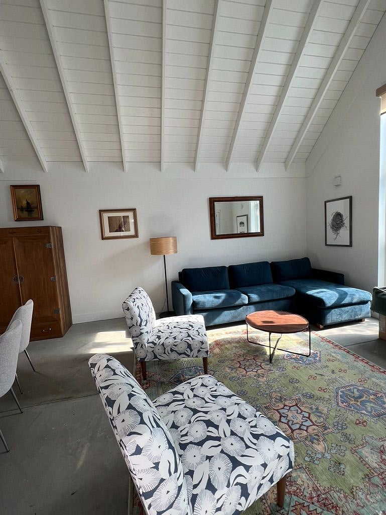 Great room with kitchen, dining and living. Very tall vaulted ceiling, doors that accordian open to terrace for full indoor/outdoor living. 