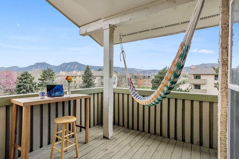 Upstairs deck with working nook and hammock