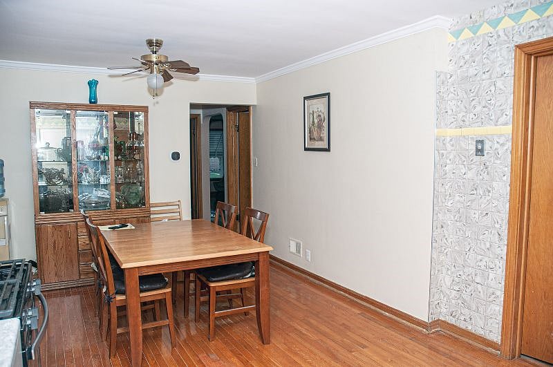 Harwood floors, old fashion kitchen table to eat or work from. Outlets behind China cabinet