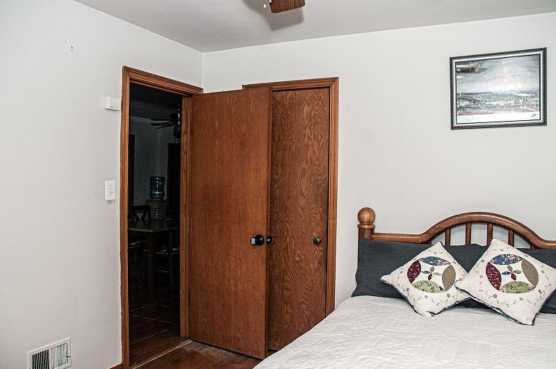2nd Bedroom - Full size bed. room has a smart tv. nightstand, full dresser and private closet. Each bedroom has it's own private code lock