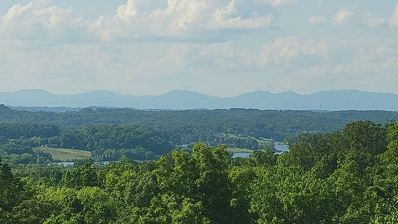 Daytime view from the entrance to the apartment (and also from the kitchen and master bedroom/balcony). Cumberland Mountains & Fort Loudoun Lake, watching boats go by