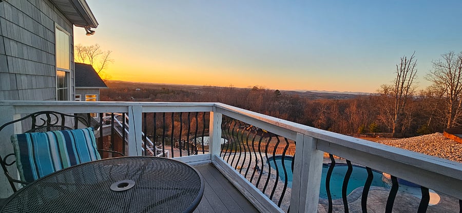 Sunset view from the balcony. You can also enjoy listening to the waterfall in the pool from your balcony (though pool is not usable by guests, for insurance reasons)