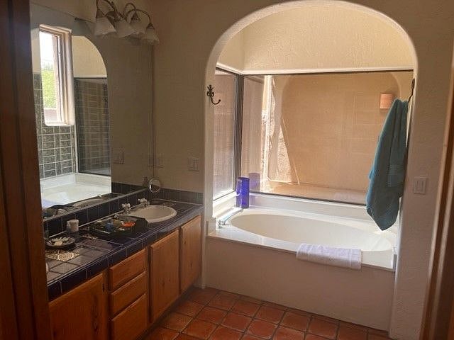 Master Bathroom -- Stepdown Shower is not visible but to the right of this Bathtub (Tub is generally not used due to water constraints)