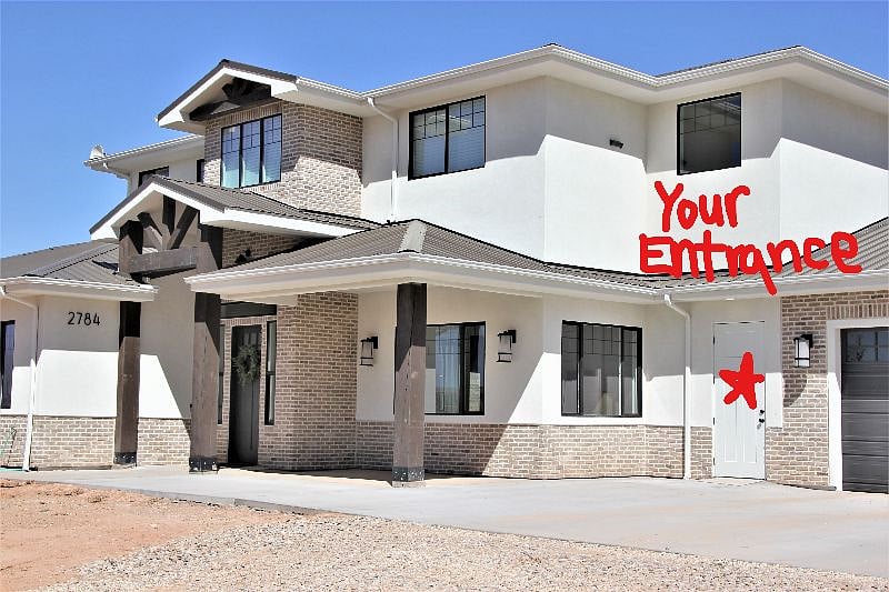This is our home. Tenant entrance is marked with the red star. The second story windows on the front of the home are those of the rental unit. 
