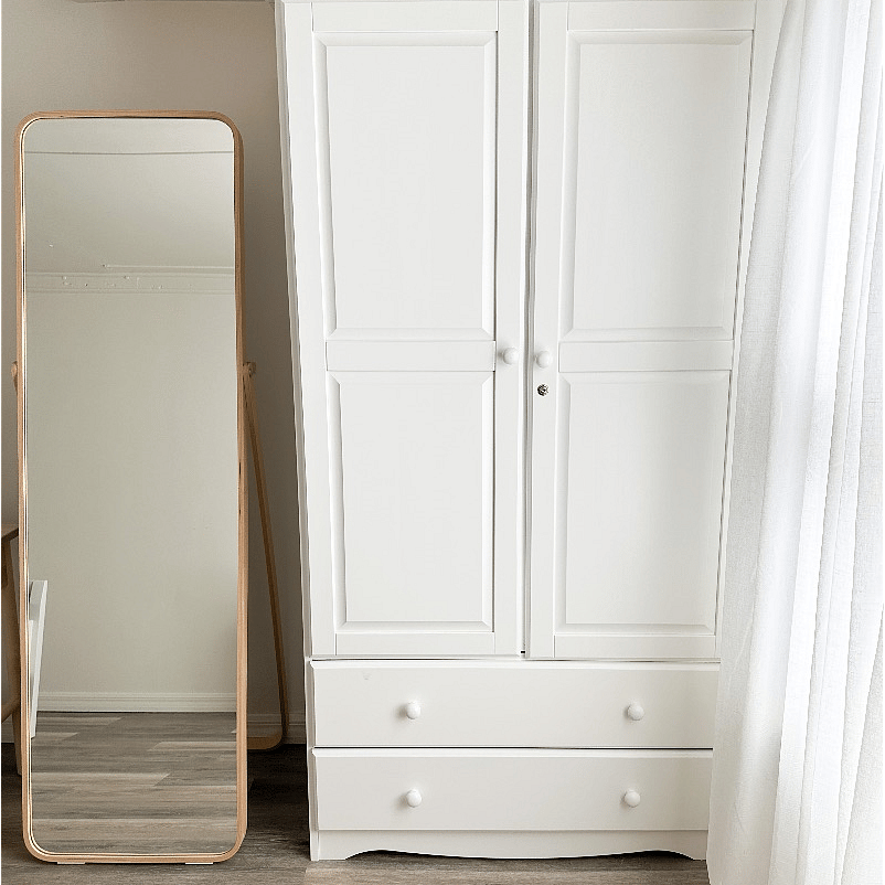 Full body mirror, an armoire with wooden hangers, iron with a compact ironing board is provided.