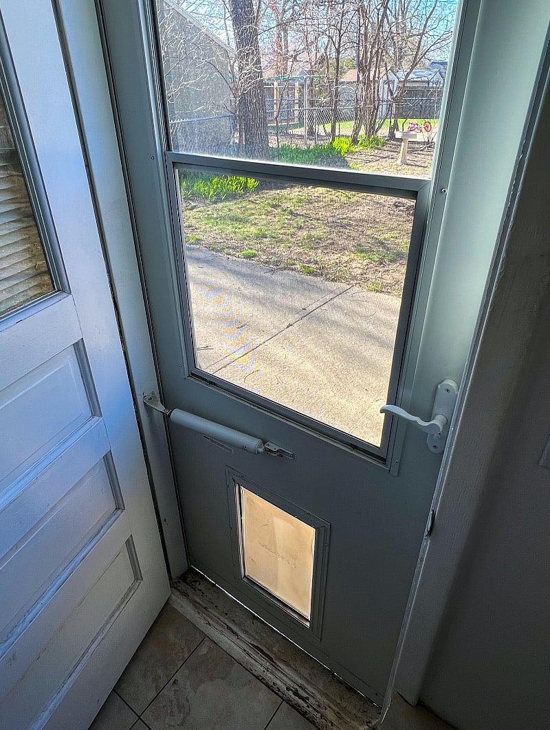 Storm door has a pet door :)