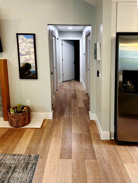 Hallway to bedrooms closets on both sides