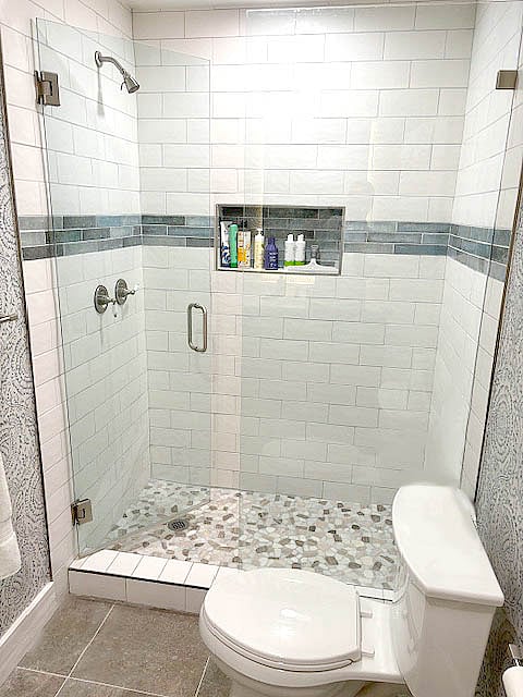 Large shower across from dual sinks