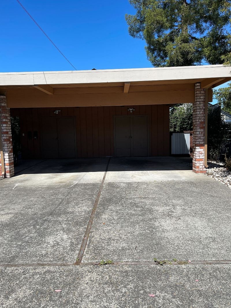 Dedicated parking space (right hand side), covered with small locked storage.