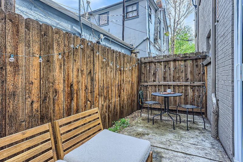 Patio attached to the bedroom that provides great light. Enjoy time relaxing on the outside couch or enjoy your coffee with birds chirping. 