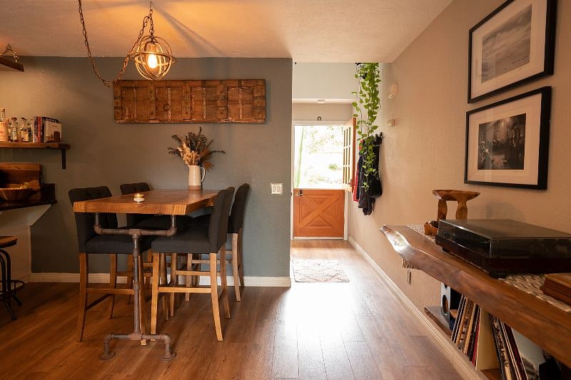 Dining area with view of front entryway. Note the french door!