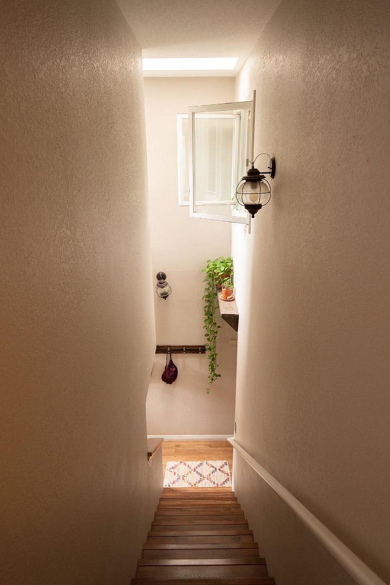 Hallway leading down from the bedrooms to the main living area.