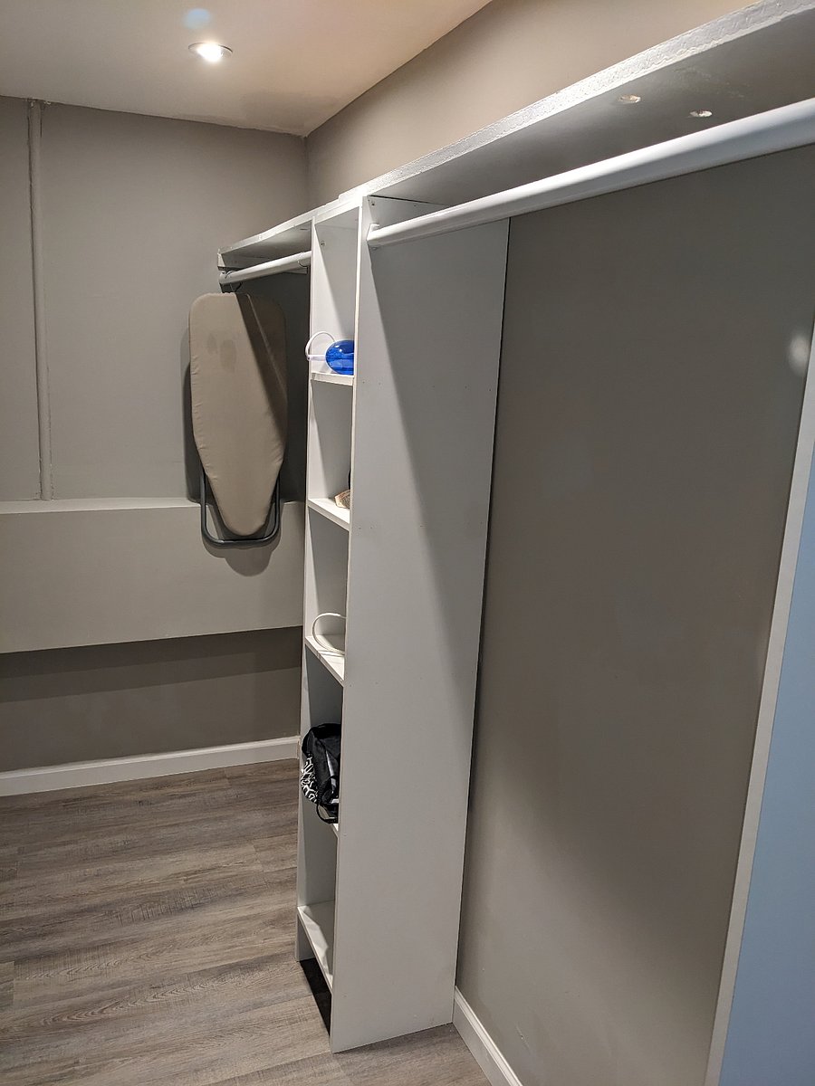 Master's Walk-in Closet Pic 1: Includes iron board