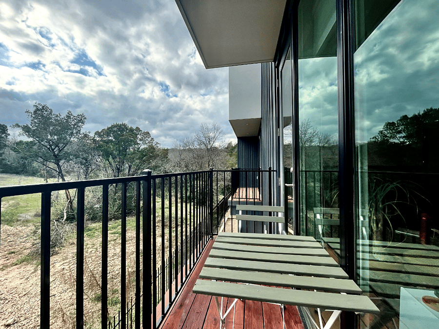 2nd floor patio off living room with treetop views
