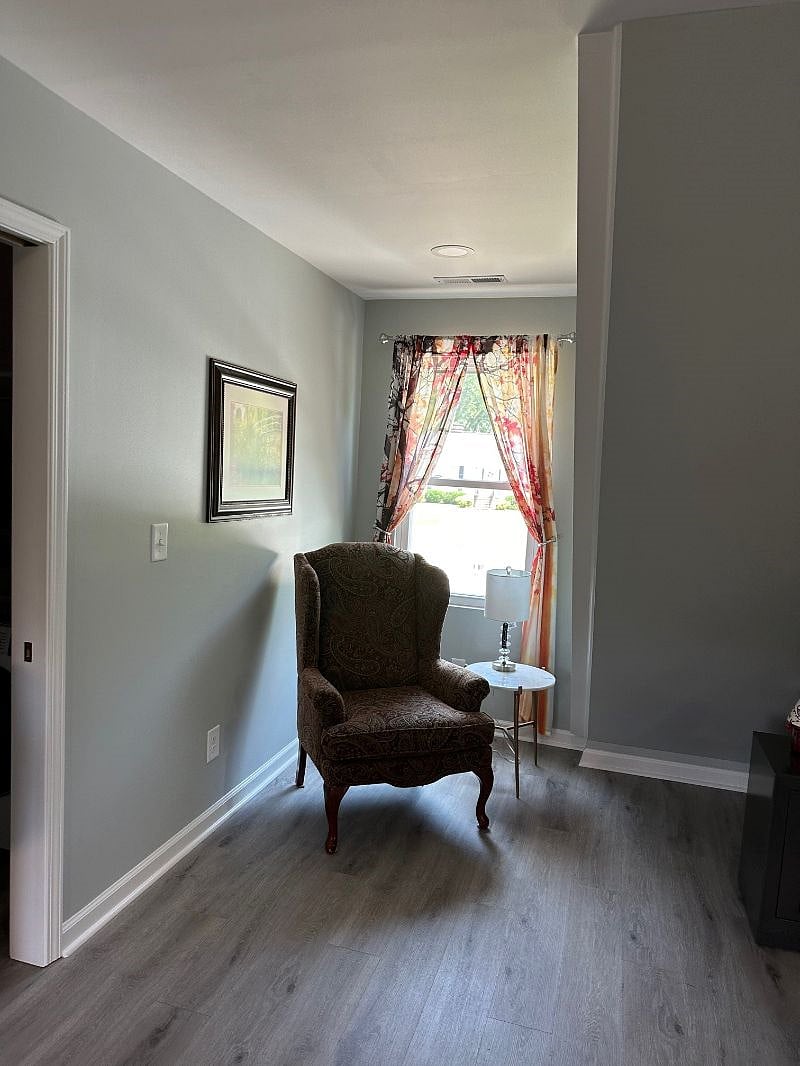 Cozy reading nook with front view of neighborhood.