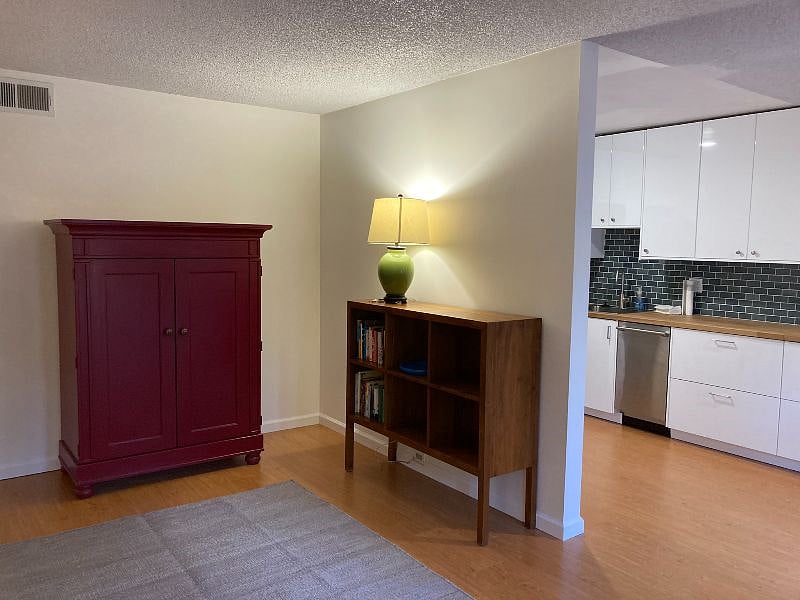 Roku TV is inside red armoire
