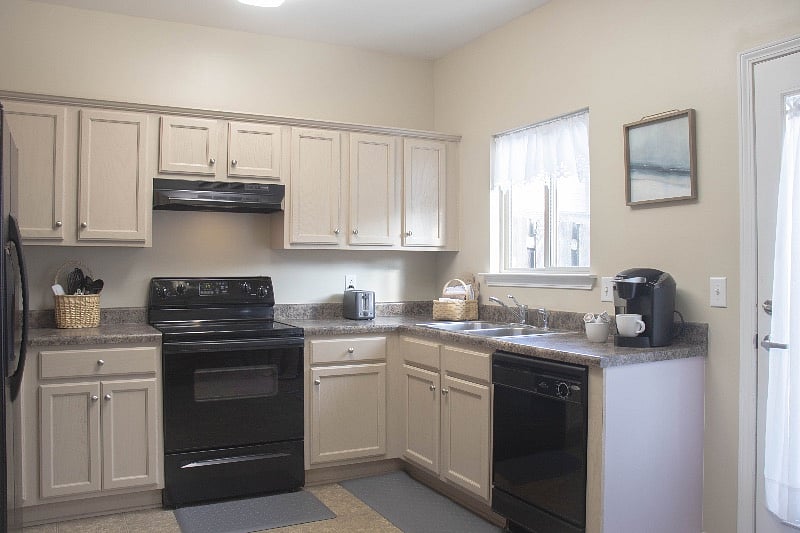 Large full featured kitchen supplied with cooking necessities