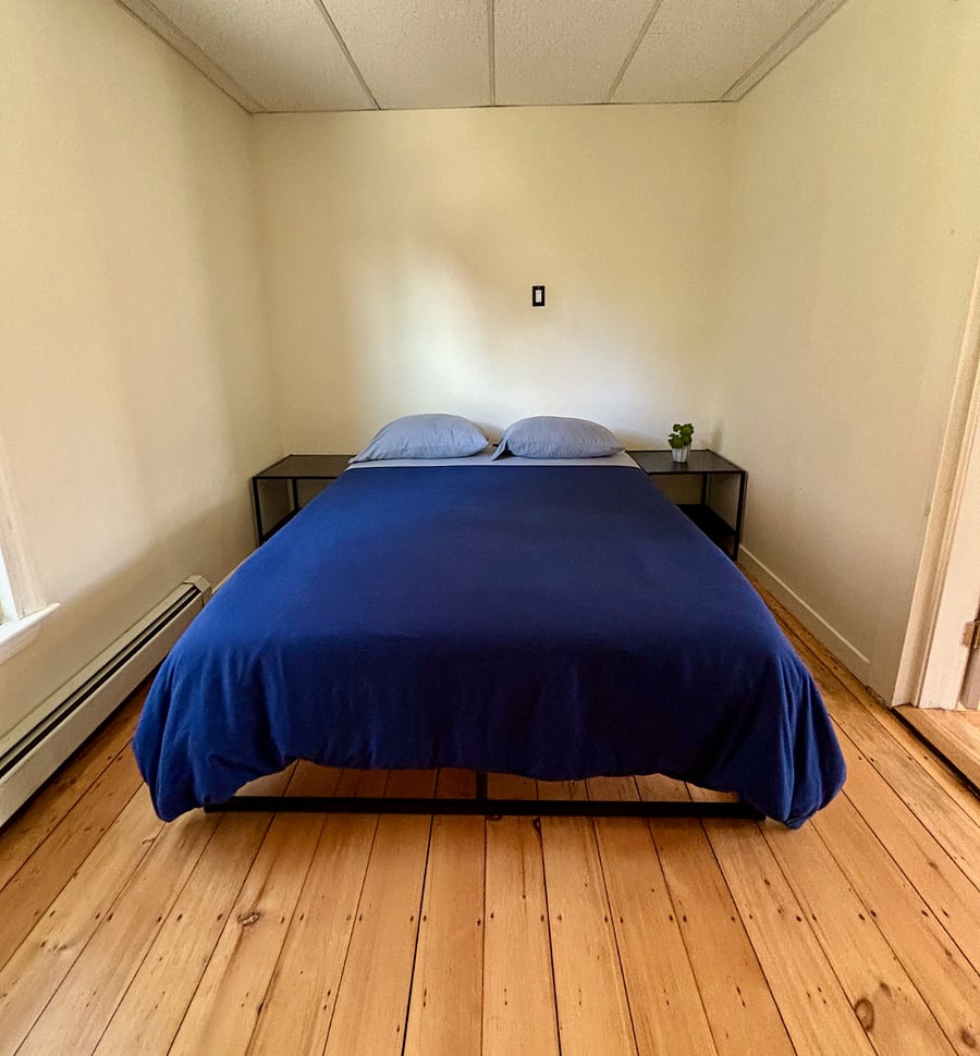 Bedroom one with large closet on opposite wall